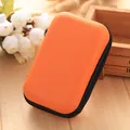 Compact orange hard-shell case for portable earphone and charging cable storage - Orange