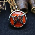 Butterfly design pendant necklace featuring a vibrant round red stone center inlay - Red Jasper