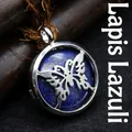 Vintage style round lapis lazuli pendant necklace with silver butterfly pattern detail - Lapis Lazuli