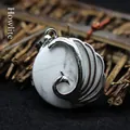 Exaggerated peacock pendant necklace with white howlite stone and silver metal details - Howlite