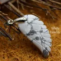 Hand-carved natural white howlite stone angel wing pendant with silver bail connector - Howlite