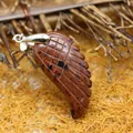 Elegant carved wing shaped mahogany obsidian stone pendant with silver bail accessory - Mahogany Obsidian