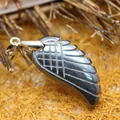 Minimalist hand-carved wing pendant made of natural black hematite with a silver-tone bail - Iron Ore