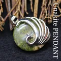 Peacock-shaped pendant necklace featuring a natural green and pink unakite gemstone - Unakite