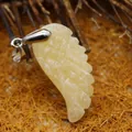 Cream yellow carved wing pendant crafted from natural stone for minimalist jewelry - Yellow Jade