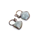 Macro detail of natural raw fluorite stone pendants with vintage copper plating frames - Aquamarine