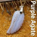 Natural purple agate gemstone pendant featuring a detailed carved angel wing design - Purple Agate