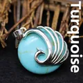 Exaggerated silver peacock pendant with round turquoise gemstone - Turquoise