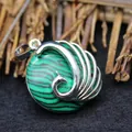Exquisite peacock pendant necklace featuring vibrant green malachite stone inlay in silver - Malachite