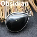 Elegant polished natural black obsidian teardrop pendant with silver-toned metal bail - Obsidian