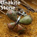 Handcrafted butterfly pendant featuring natural unakite teardrop stones in a silver setting - Unakite