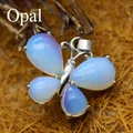 Elegant butterfly pendant featuring translucent opalite stone in a natural style - Opal