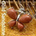 Butterfly pendant with sparkling goldstone in a silver-toned metal frame - Gold Sandstone