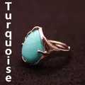 Vintage silver-tone adjustable ring featuring a large teardrop turquoise stone inlay - Turquoise
