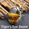 Adjustable silver-tone ring featuring a large polished oval tiger eye gemstone inlay - Adjustable Open / Tiger's Eye
