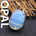 Statement adjustable ring featuring a large oval blue faux opal stone with silver-tone band - Adjustable Open / Opal