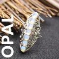 Exaggerated silver-toned open ring featuring seven vertical opalescent stones - Adjustable Open / Opal