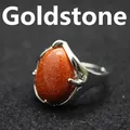 Vintage style teardrop-shaped goldstone open ring featuring a glittering orange stone - Gold Sandstone