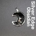 Elegant black obsidian crescent moon pendant featuring a decorative silver metallic edging - Moon Obsidian Pendant (Silver Edge)
