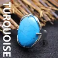 Exaggerated silver-tone ring featuring a large oval blue turquoise stone with adjustable band - Adjustable Open / Blue Turquoise