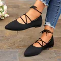 Detail view of black fly-knit pointed-toe ballet flats with lace-up ankle straps - 36 / Black