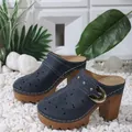 Side view showing laser-cut details and gold buckle on navy blue platform mule shoes - 36 / Blue
