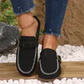 Detailed shot of black suede flat mules showing white stitching and buckle strap - Stitched Black with Buckle