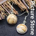 Elegant round natural picture jasper drop earrings with decorative silver-tone hooks - Jasper