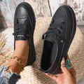 Detailed close-up view of stylish black platform sneakers with pebbled leather texture - 35 / Black