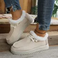 Detail view of warm beige winter snow boots with white faux fur lining and flat thick soles - 36 / Off White