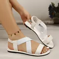 Detail view of the white elastic crossover straps and open-toe design on summer sandals - 36 / Roman Style (55#) / White
