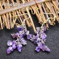 Handcrafted purple amethyst chip stone drop earrings featuring golden fish hooks - Amethyst