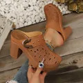 Detail view of fashionable tan hollow-out block heel mules with stylish gold buckle - Tan