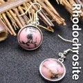 Minimalist silver-tone hook earrings featuring round polished pink Rhodonite stones - Rhodonite