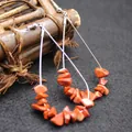 Statement red stone chip drop earrings featuring a large teardrop frame and silver hook - Red Jasper
