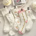Five pairs of Japanese JK style white crew socks with ruffles and floral patterns - One Size / Creamy White Tulip Embroidery