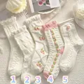 White JK style ruffle mid-calf socks with delicate pink floral embroidery detail - One Size / Creamy White 3D Pink Flower