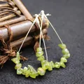 Handmade teardrop hoop earrings with green peridot crystal chips for a bohemian style - Peridot
