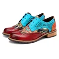 Detailweergave van de levendige paisley-print en het leer op vintage brogue-schoenen - 36 / Blauw Splicing