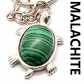 Detailed silver turtle keychain pendant featuring a genuine green malachite stone inlay - Malachite