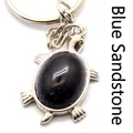 Turtle keychain with oval blue sandstone pendant in silver metal frame - Blue Sandstone