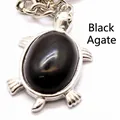 Exquisite silver turtle pendant keychain featuring a large polished black onyx stone inlay. - Black Agate