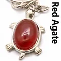 Silver plated turtle pendant keychain featuring a polished red agate stone inlay detail - Red Agate