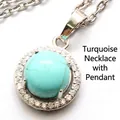 Collier élégant de couleur argentée avec un pendentif turquoise et halo de strass brillants - Collier avec Pendentif (Avec Chaîne) / Turquoise