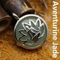 Artistic silver yoga lotus pendant necklace featuring a green aventurine gemstone inlay - Aventurine Jade