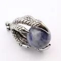 Close-up of vintage silver dragon claw pendant holding a blue sodalite bead - Blue Sodalite