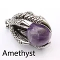 Macro detail of retro silver dragon claw pendant holding a round purple amethyst bead - Amethyst