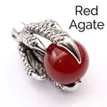 Close-up detail of vintage dragon claw pendant holding a red agate bead - Red Agate