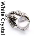 Detailed macro shot of vintage silver dragon claw pendant holding a clear crystal ball - White Crystal