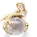 Gold plated dragon claw pendant necklace featuring a clear white glass bead orb - Synthetic White Glass